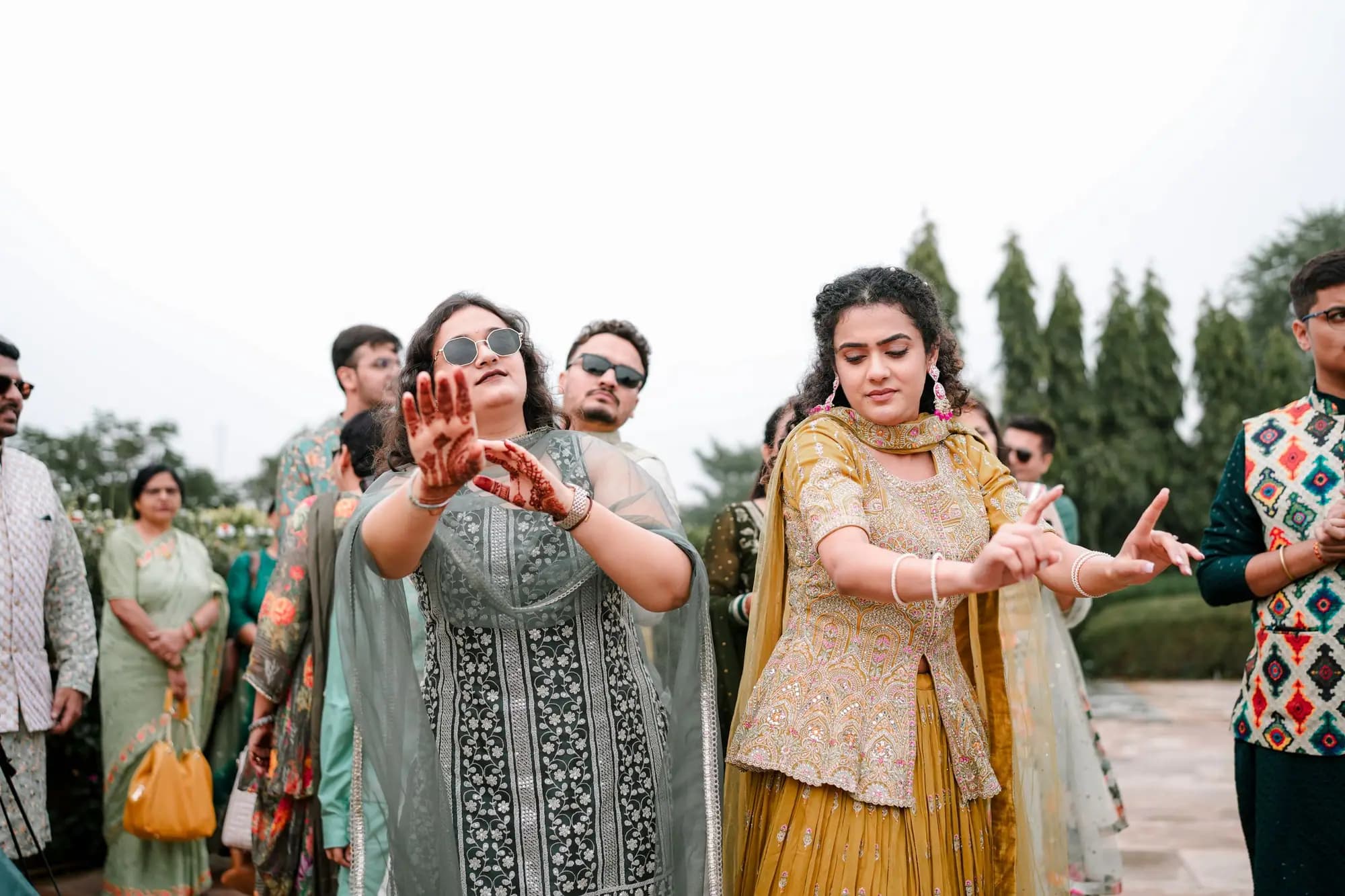 People dancing at a nighttime wedding celebration.