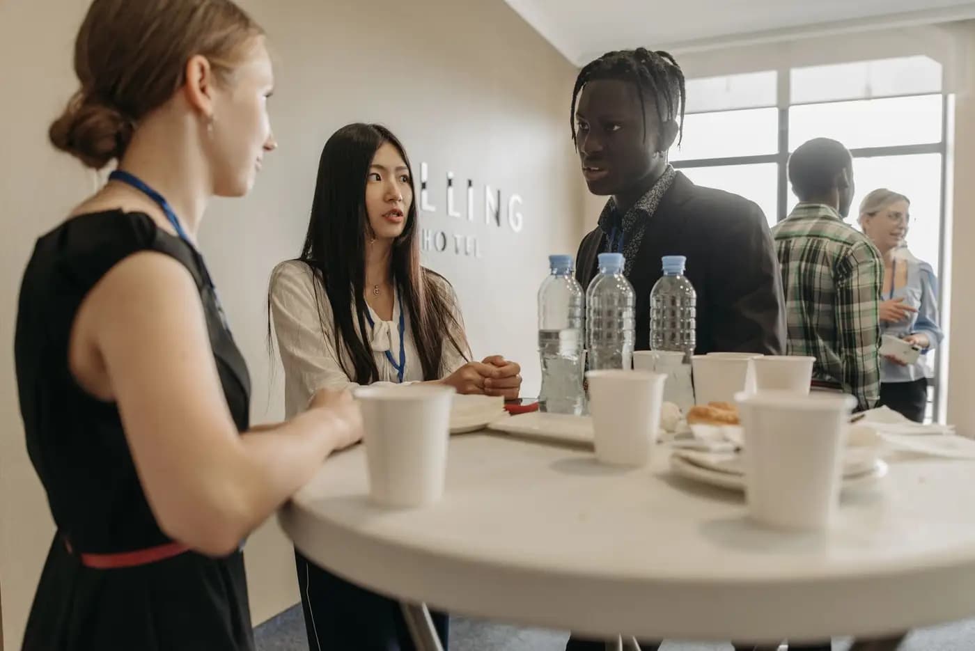 People gathered around a table at a private event.